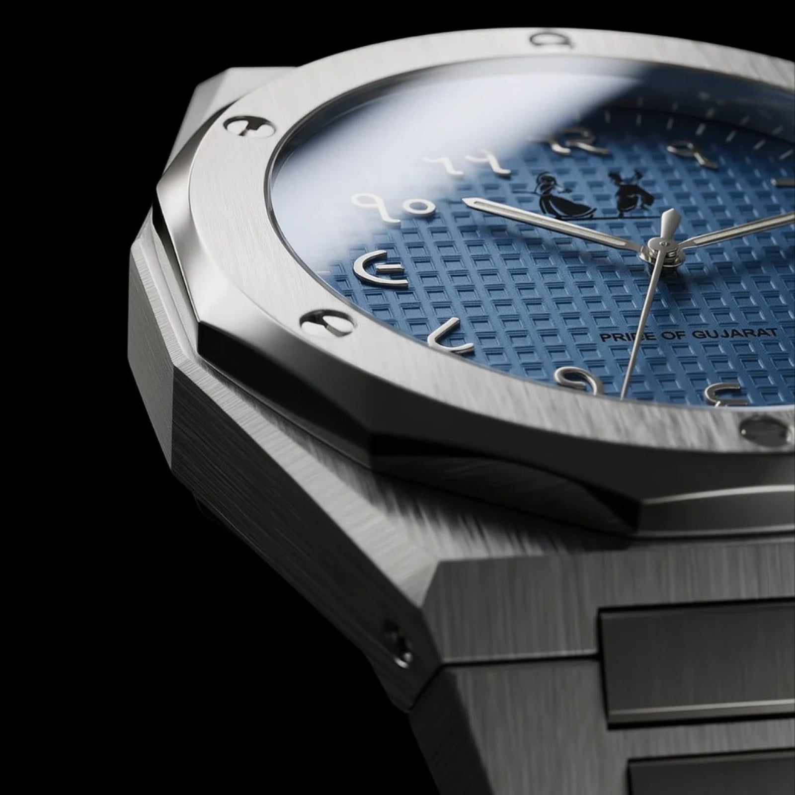 Pride of Gujarat watch side-angle macro showing brushed 316L steel case, integrated bracelet, and screw-down crown on black studio background
